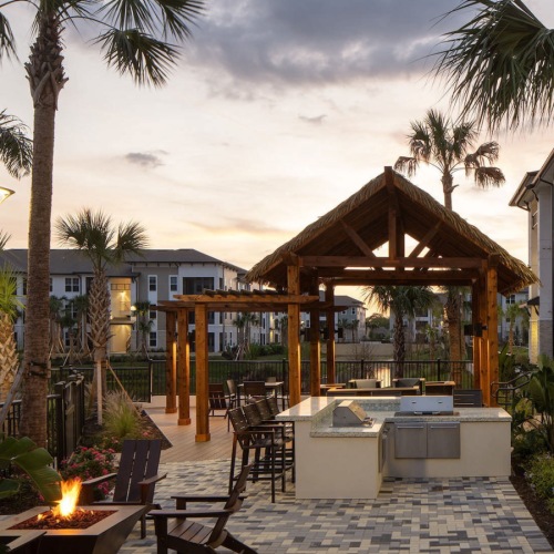 Take advantage of all The Ensley has to offer grilling area at dusk