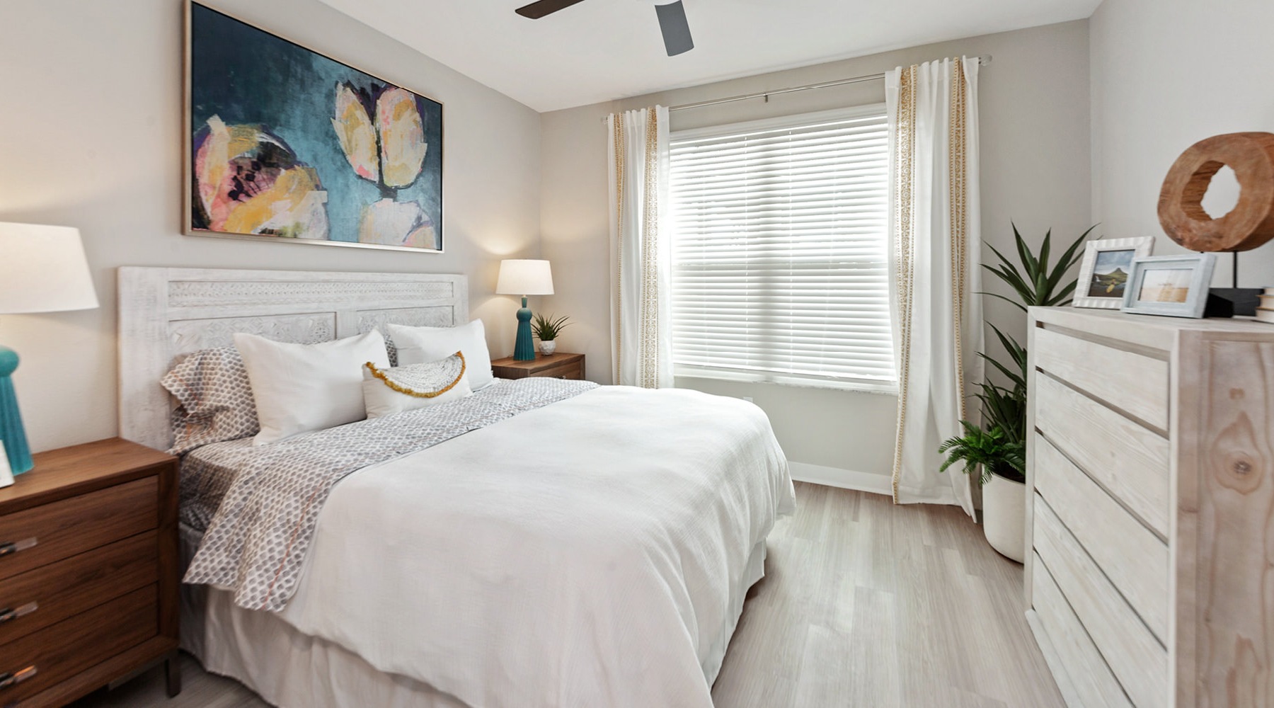 Sleep in style Bedroom with natural lighting and high ceilings
