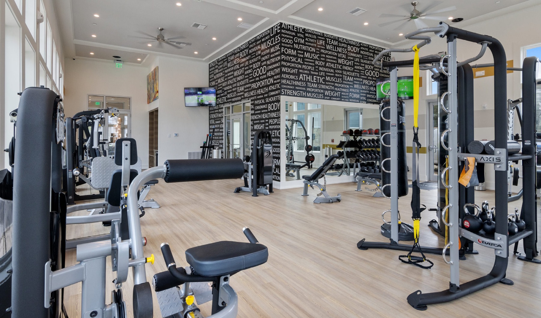 Open and well-lit fitness center Open and well-lit fitness center